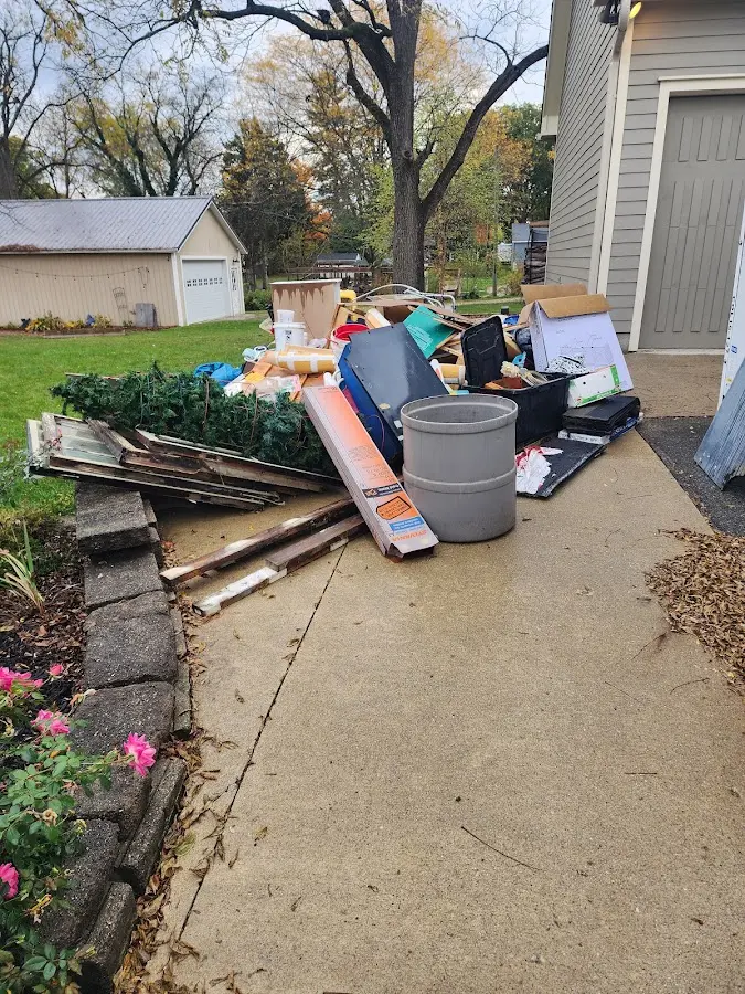 Dumpster being loaded with debris for 3 Yard Dumpster Rental in Carlyle